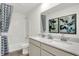 Bathroom boasts dual vanities, a shower/tub combo, and stylish geometric decor at 3422 Wetherby Pl, Danville, IN 46122