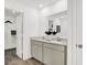 Bathroom with double vanity, large mirror, and walk-in shower at 3422 Wetherby Pl, Danville, IN 46122