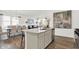 Open concept kitchen with island, dining area, and stainless steel appliances at 3422 Wetherby Pl, Danville, IN 46122