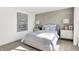Bedroom with light-blue bedding and textured wallcovering at 3422 Wetherby Pl, Danville, IN 46122