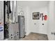 Basement laundry area with furnace, water heater, and space for storage at 3422 Wetherby Pl, Danville, IN 46122