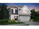 Two-story home with a gray and navy exterior, and a two-car garage at 3422 Wetherby Pl, Danville, IN 46122