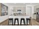 Kitchen island with seating, quartz countertop and stainless steel appliances at 3422 Wetherby Pl, Danville, IN 46122