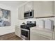 Stainless steel appliances and light gray cabinets in this kitchen at 3422 Wetherby Pl, Danville, IN 46122