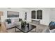Cozy living room with a neutral color scheme and statement artwork at 3422 Wetherby Pl, Danville, IN 46122