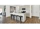 Modern kitchen with light cabinets, stainless steel appliances, and an island with seating at 3422 Wetherby Pl, Danville, IN 46122