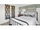 Bright bedroom with a metal bed frame and large mirrors at 3422 Wetherby Pl, Danville, IN 46122
