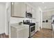 Modern kitchen with stainless steel appliances and light-colored cabinetry at 3422 Wetherby Pl, Danville, IN 46122
