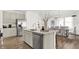 Open concept kitchen with island, stainless steel appliances, and dining area at 3422 Wetherby Pl, Danville, IN 46122