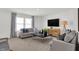 Relaxing living room, featuring a large TV and ample seating at 3422 Wetherby Pl, Danville, IN 46122