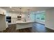Modern kitchen featuring white cabinets, island, and stainless steel appliances at 6272 Willow Branch Way, Plainfield, IN 46168
