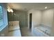 Elegant bathroom with double vanity, soaking tub, and walk-in shower at 6272 Willow Branch Way, Plainfield, IN 46168