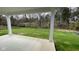 Large patio overlooking a grassy backyard and trees at 6272 Willow Branch Way, Plainfield, IN 46168