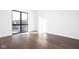 Bright bedroom with hardwood floors and large window at 855 N East St # 205, Indianapolis, IN 46202