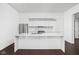Modern kitchen with white cabinetry and large island at 855 N East St # 205, Indianapolis, IN 46202