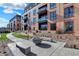 Community courtyard with fire pit and seating at 855 N East St # 205, Indianapolis, IN 46202