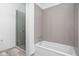 Bathroom with shower and grey tile at 855 N East St # 205, Indianapolis, IN 46202