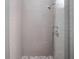Shower with grey tile and glass door at 855 N East St # 205, Indianapolis, IN 46202