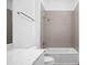 Bathroom with shower, bathtub and grey tile at 855 N East St # 205, Indianapolis, IN 46202