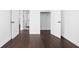 Bedroom with hardwood floors and access to closet and hallway at 855 N East St # 205, Indianapolis, IN 46202