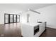 Modern kitchen with large island and hardwood floors at 855 N East St # 205, Indianapolis, IN 46202