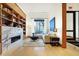 Modern living room features a marble fireplace, built-in shelving, and comfortable seating at 855 N East St # 205, Indianapolis, IN 46202