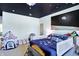 Space-themed bedroom with mural, playful decor, and comfortable bed at 7775 Ridge Rd, Indianapolis, IN 46240