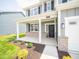 Inviting front porch with brick columns and a black front door at 179 Velvet Hat Rd, Danville, IN 46122