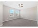 Bright bedroom with neutral walls, carpet, and two large windows at 2377 Chandler Way, Greenwood, IN 46143