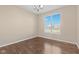 Bright dining room with hardwood floors and large window at 2377 Chandler Way, Greenwood, IN 46143