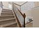 Elegant staircase with dark wood railings and metal accents at 2377 Chandler Way, Greenwood, IN 46143