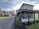 Two-story house with gray siding, detached garage, and a covered front porch at 16185 E 281St St, Atlanta, IN 46031