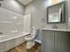 Bathroom with shower/tub combo, toilet, and vanity with marble top at 1692 Victor Dr, Martinsville, IN 46151