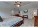 Main bedroom with large bed, dresser and TV at 13811 Driftwood Dr, Carmel, IN 46033