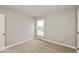 Simple bedroom with neutral walls, carpeting, and a window at 15278 Quiet Trace Ct, Fishers, IN 46037