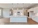 Modern kitchen with white cabinets, quartz countertops and island at 15278 Quiet Trace Ct, Fishers, IN 46037