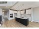 Modern kitchen with white cabinets, a large island, and stainless steel appliances at 19915 Chatham Green Dr, Westfield, IN 46074