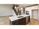 Large kitchen island with quartz countertop and dark cabinets at 19915 Chatham Green Dr, Westfield, IN 46074