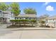 Newly renovated gray house with bushes and chain link fence at 641 E 33Rd St, Indianapolis, IN 46205