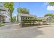 Charming gray house with a covered porch and well-manicured lawn at 641 E 33Rd St, Indianapolis, IN 46205