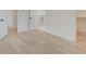 Spacious bedroom with light hardwood floors and access to closets and bath at 1544 Hoyt Ave, Indianapolis, IN 46203