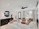 Bright living room with comfy seating, a fireplace, and large windows at 1544 Hoyt Ave, Indianapolis, IN 46203