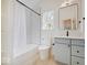 Modern bathroom featuring a bathtub, shower, and light gray vanity at 1544 Hoyt Ave, Indianapolis, IN 46203