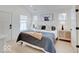 Bright and airy primary bedroom with a king-size bed and plenty of natural light at 1544 Hoyt Ave, Indianapolis, IN 46203