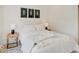 Bright bedroom with a queen-size bed and stylish nightstands at 1544 Hoyt Ave, Indianapolis, IN 46203