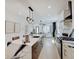 Open concept kitchen with marble countertops and an island with seating at 1544 Hoyt Ave, Indianapolis, IN 46203