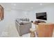 Finished basement with sectional sofa and large TV at 1544 Hoyt Ave, Indianapolis, IN 46203
