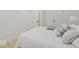 Light-filled basement bedroom with a queen bed and plush bedding at 1544 Hoyt Ave, Indianapolis, IN 46203