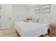 Bright, spacious basement bedroom with a queen-size bed and neutral decor at 1544 Hoyt Ave, Indianapolis, IN 46203
