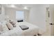 Comfortable basement bedroom featuring a queen bed and ample natural light at 1544 Hoyt Ave, Indianapolis, IN 46203
